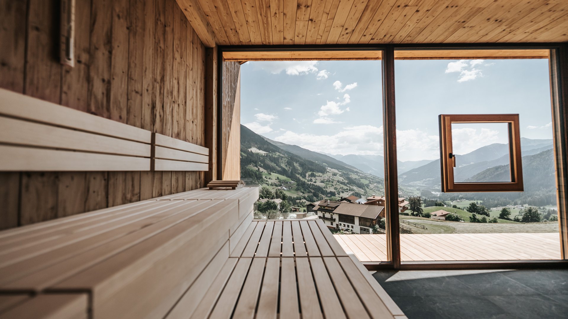 Inclusive services Wooden sauna with panoramic window overlooking mountains and valley