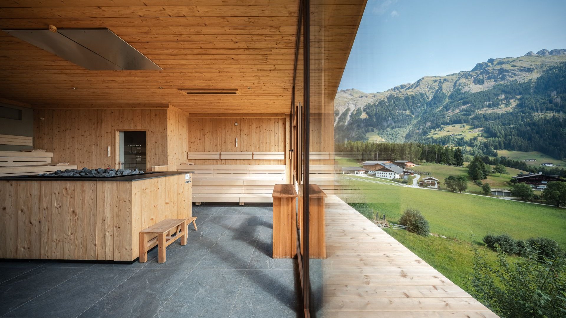 Home Erlebnisort Gassenhof Wooden sauna with panoramic window and mountain view