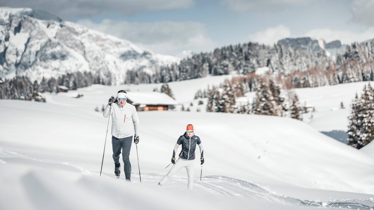 Cross-country skiing in and around Ridnaun Two people cross-country skiing in a snowy mountain area