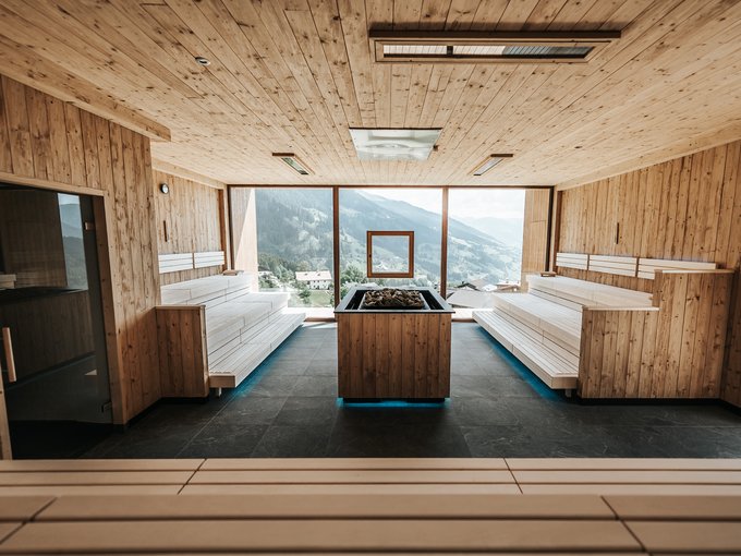 New at Gassenhof Modern wooden sauna room with large windows and mountain view