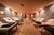 Galleria immagini Sala relax con lettini, pareti in pietra e pavimento in legno
