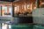 Galleria immagini Piscina interna con area lounge, soffitto in legno e vasca rialzata circolare