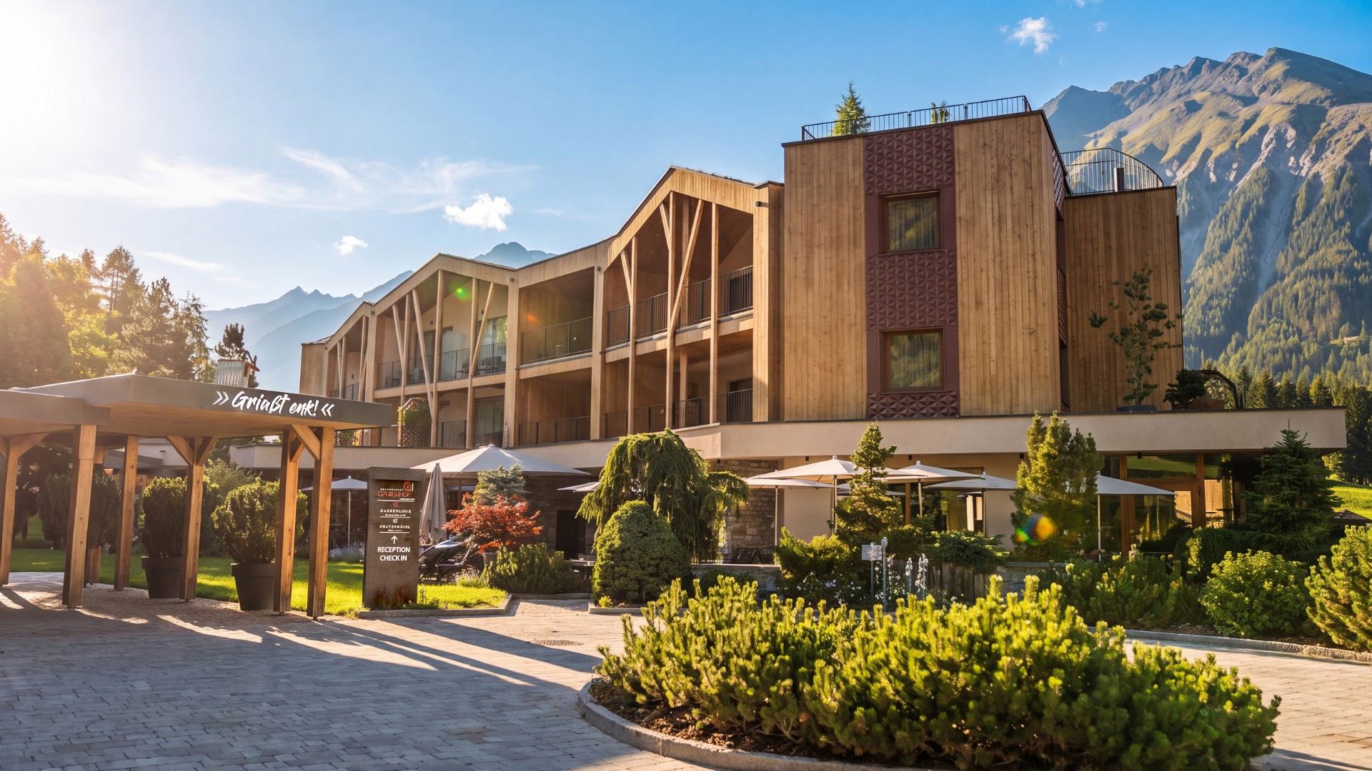 Home Erlebnisort Gassenhof Wooden hotel with garden and mountain panorama in the sunshine