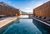 Galleria immagini Area piscina con lettini e panorama montano