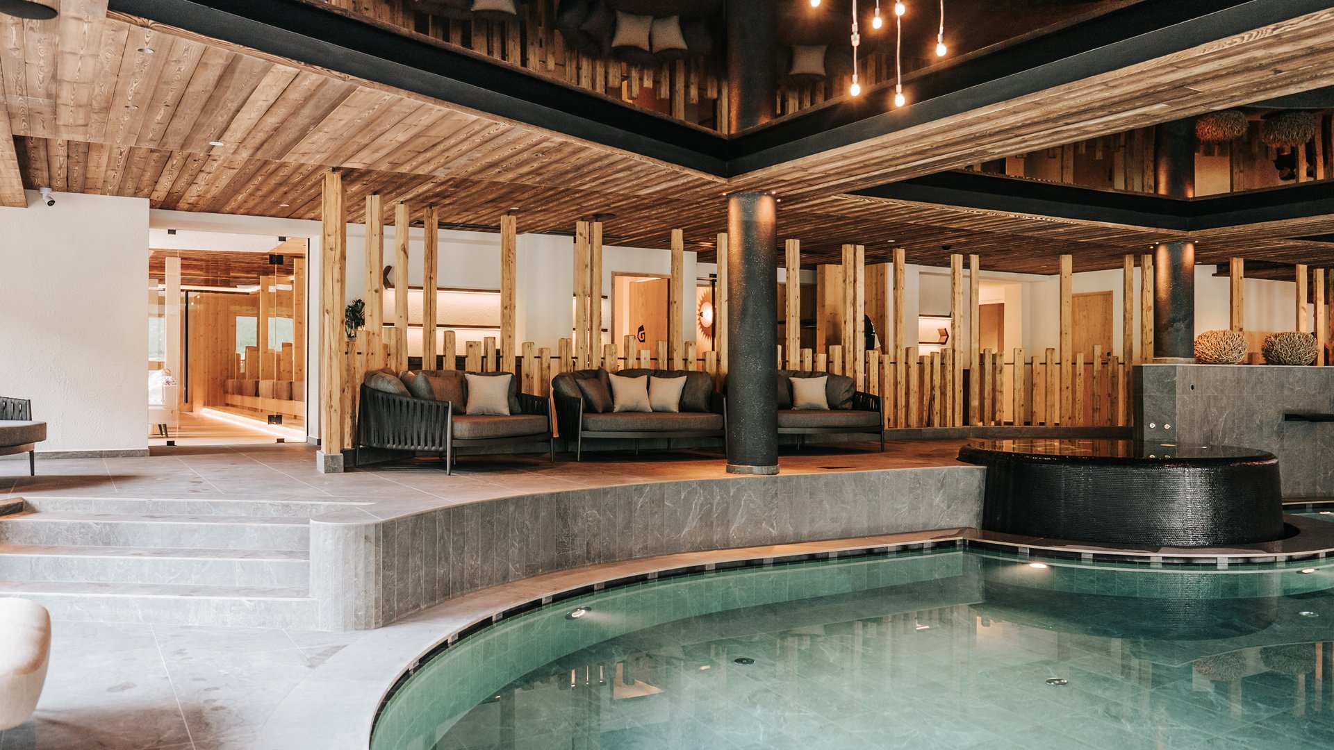 Our water world Modern wellness area with indoor pool and comfortable seating areas