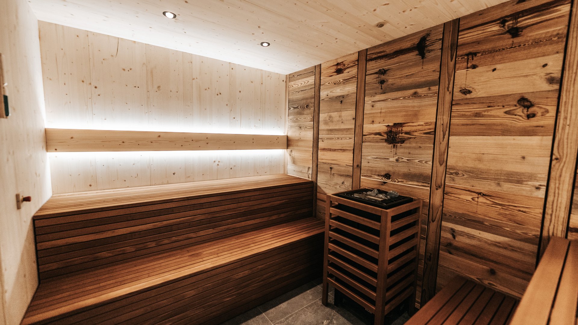 Our sauna realm Modern sauna room with wooden walls and benches