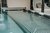 Die Bildergalerie Abdeckung eines Schwimmbeckens mit Rollschutz und Sitzgelegenheit im Hintergrund