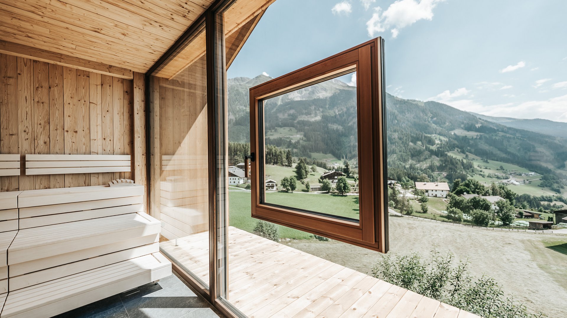 The best spot in the Ridnauntal valley Sauna area with large windows and mountain view on a sunny day