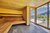 Moderner Holzbiosauna Innenraum mit Panoramafenster und Bergblick