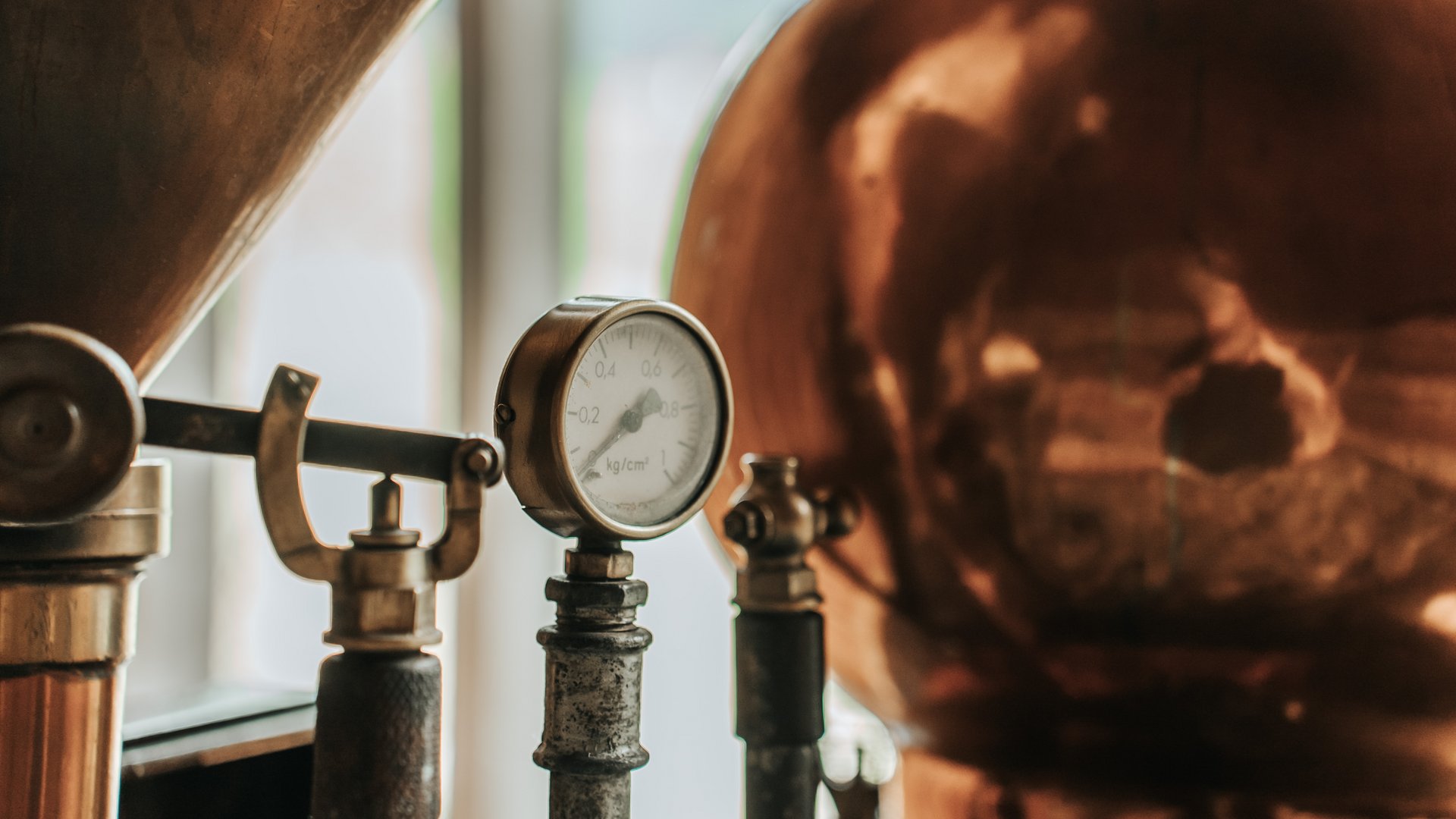 Our sauna realm Close-up of an old pressure gauge on a copper distillation apparatus